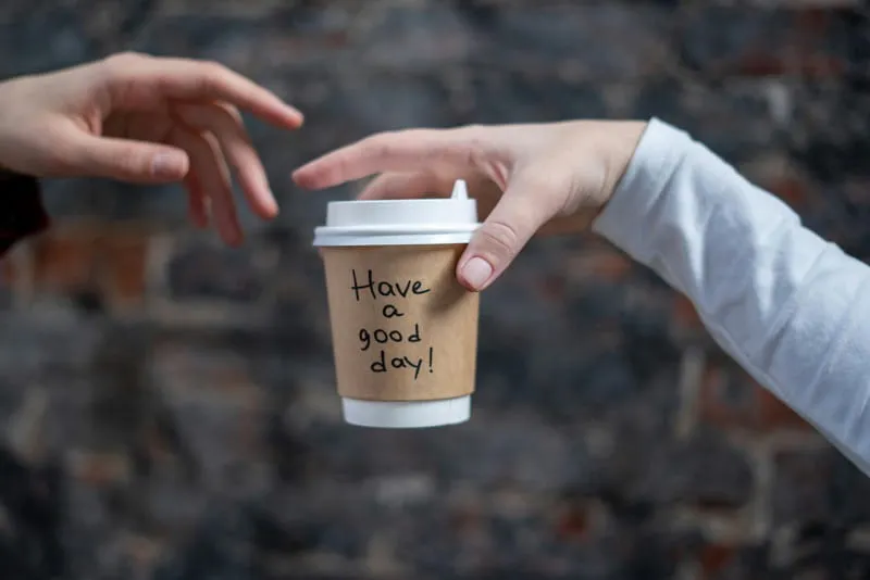 Barista serving coffee at an event